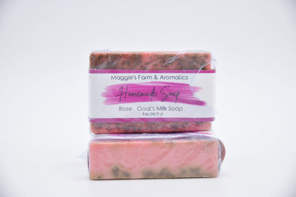 Rose goat's milk bar soap in pink packaging, shown stacked