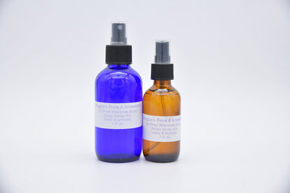 Large blue and small amber Oh Crap bathroom spray bottles