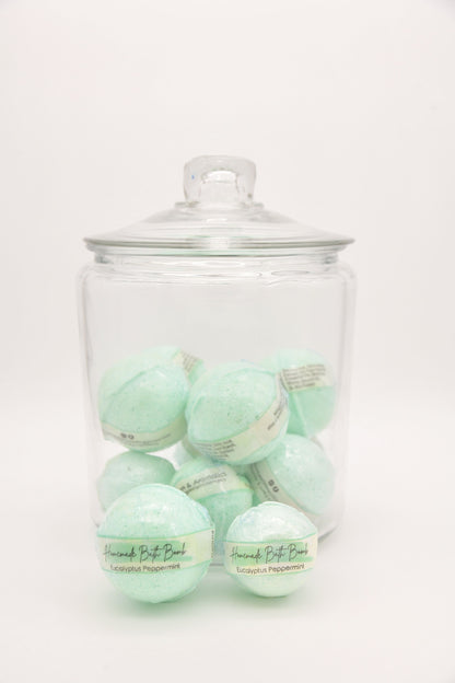 Green Eucalyptus Peppermint bath bombs arranged in a glass jar