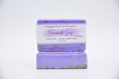 Lavender goat's milk bar soap in purple packaging, shown stacked