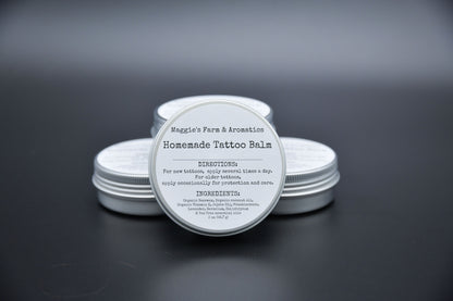 Four silver tins of tattoo care balm