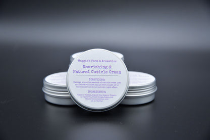 Several silver cuticle cream tins with one labeled tin facing forward