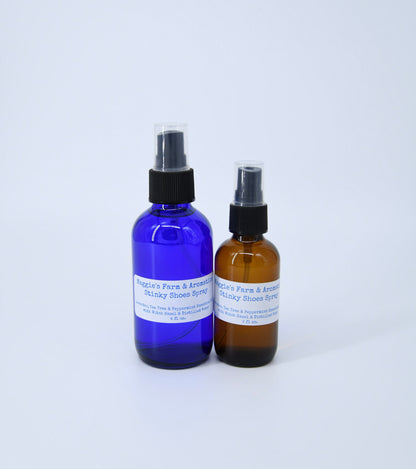 Large blue and small amber shoe spray bottles