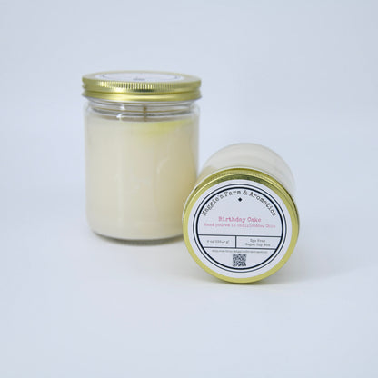 Two Birthday Cake soy candles in glass jars