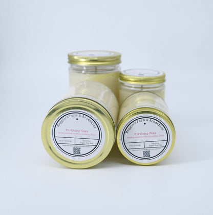 Four Birthday Cake soy candles in glass jars