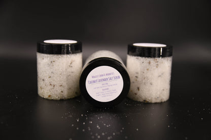 Three Coconut Lavender salt scrub jars with scattered salt