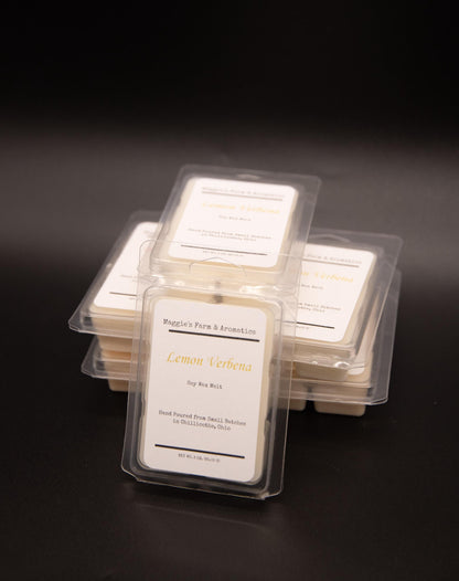Four Lemon Verbena soy wax melt packages stacked on a dark background