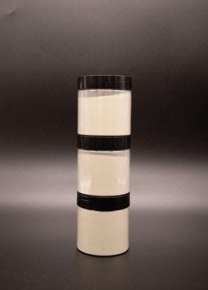 Three bentonite clay face mask jars stacked vertically
