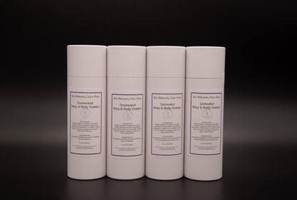 Four white body powder containers in two varieties