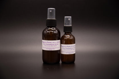 Large and small back-to-school hair mist bottles on a dark background