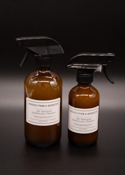 Large and small brown glass bathroom cleaner spray bottles