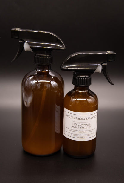 Large and small amber glass cleaner spray bottles