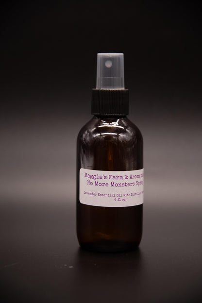 Amber kids room spray bottle on a dark surface