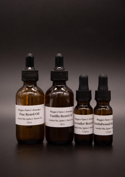 Pine, Vanilla, Lavender, and Sandalwood beard oil bottles in two sizes