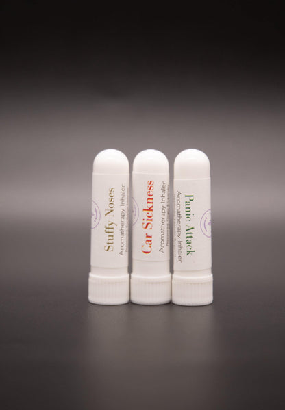 Close view of three white pocket aromatic inhalers