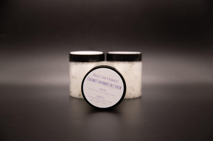 Three Coconut Lavender salt scrub jars on a dark surface