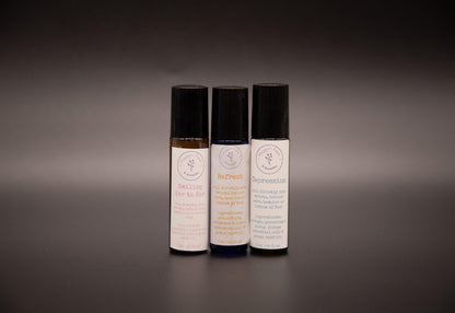 Three assorted essential oil roller blend bottles