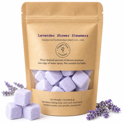 Lavender shower steamers in a resealable kraft bag with purple cubes and lavender sprigs